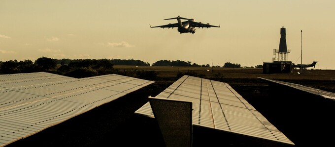 Plane flying over solar farm