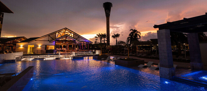 A large swimming pool during an evening