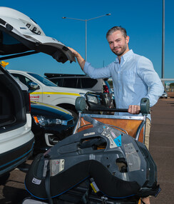 Ma at car, with baggage